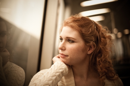 Woman looking out of train window